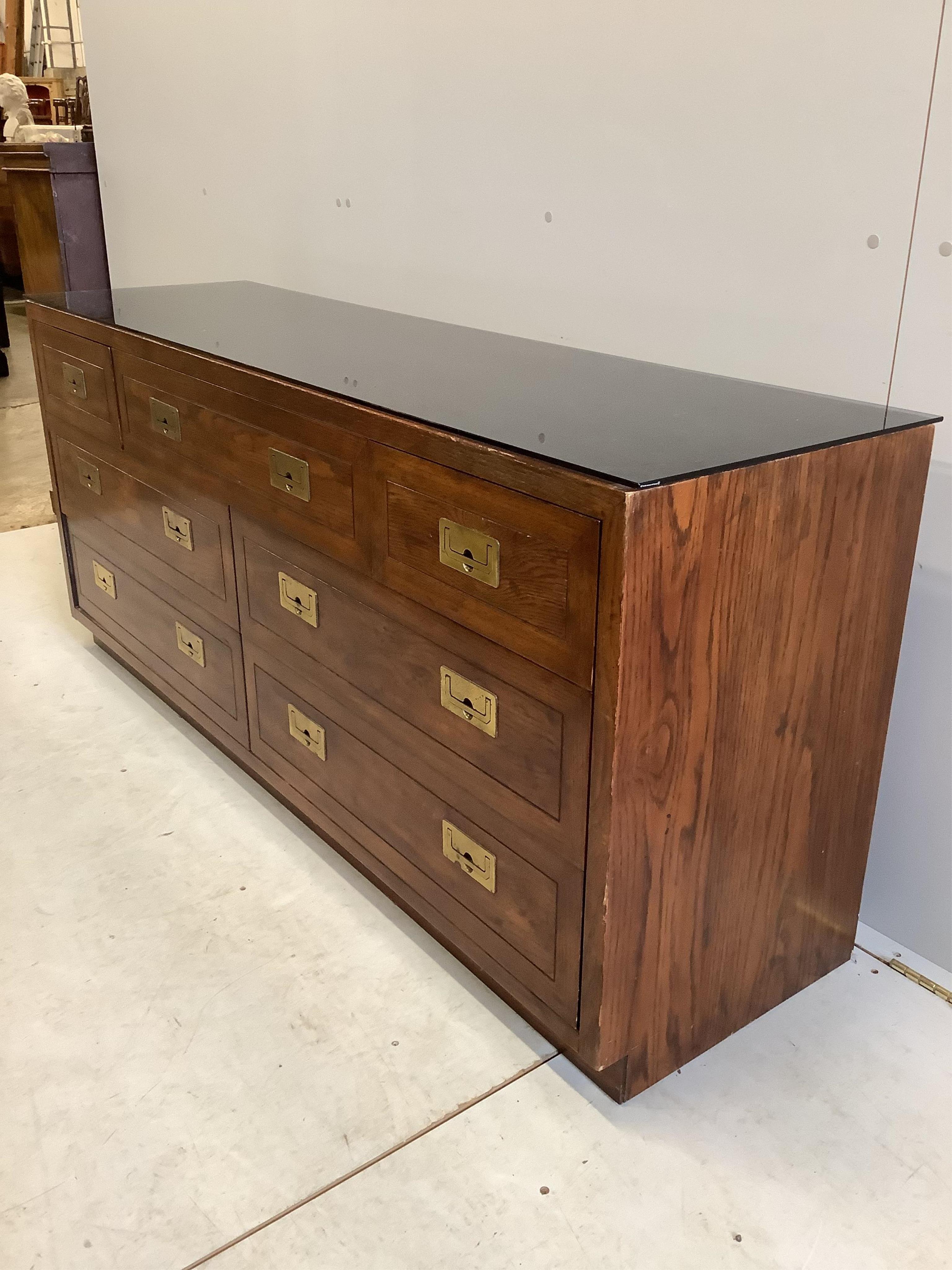 A Chinese style brass mounted elm low sideboard, width 162cm, depth 46cm, height 72cm. Condition - fair to good